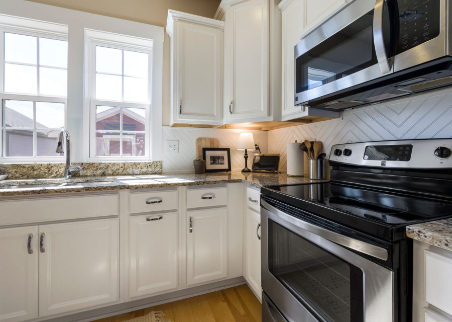 The same kitchen after new doors were fitted: Honey Oak to White Shaker, East Vancouver