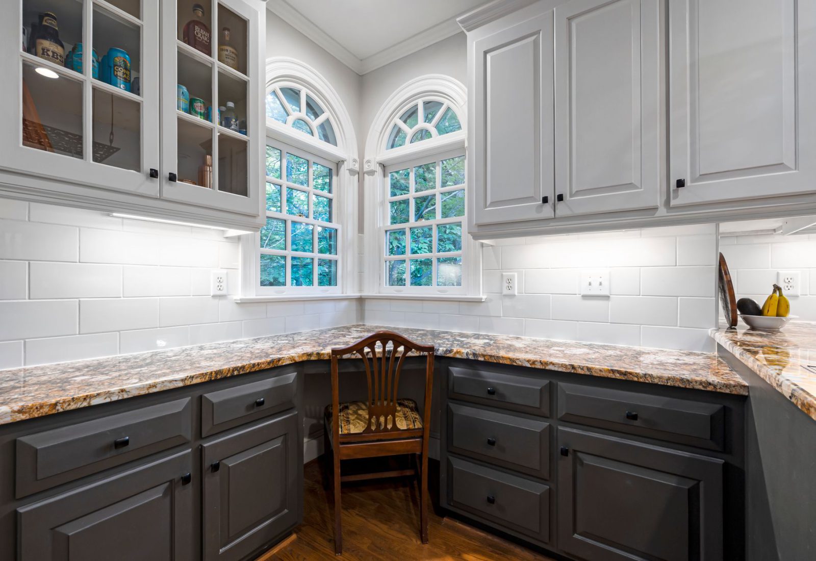 Kitchen with new light grey shaker doors and glazed upper cabinets