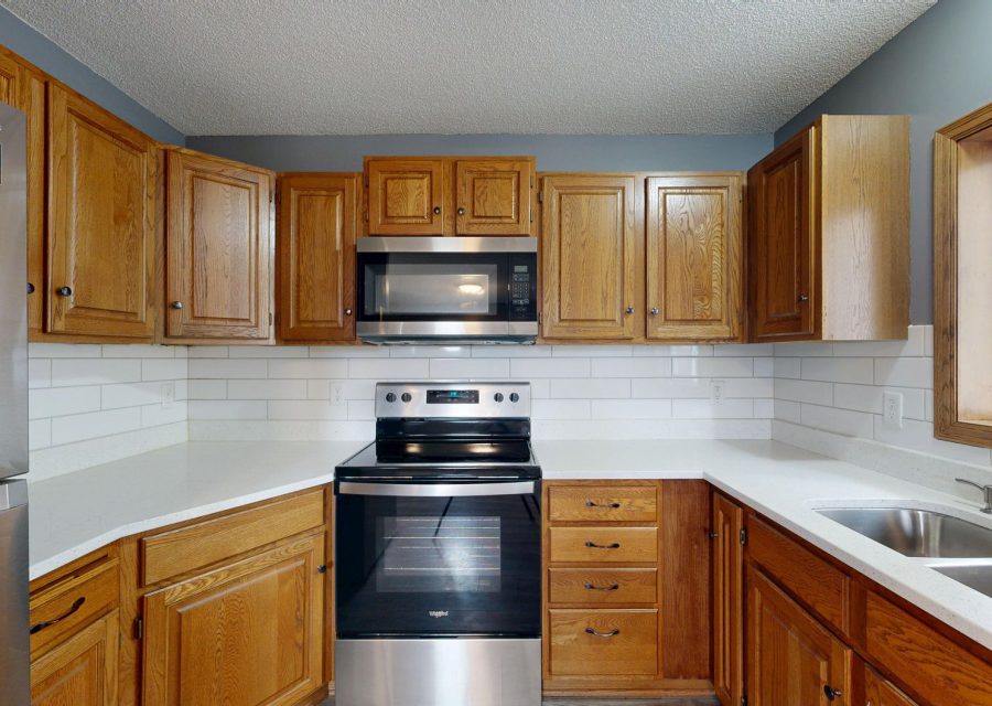 Kitchen before the work: Dated Oak to Bright White, Burnaby